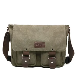 Men's large army green canvas messenger bag with brown leather straps and wide shoulder strap