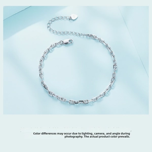 Detail of S925 sterling silver rectangular link chain bracelet with heart tag