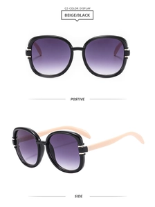 Detail of square frame sunglasses with beige temples and purple gradient lenses