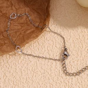 Detailed shot of silver heart link chain with lobster clasp and adjustable links