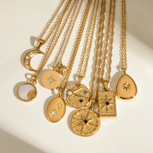 Polished stainless steel necklace featuring gold-plated moon and star zircon pendants