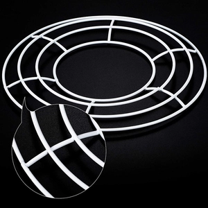 Detailed close-up of the welding points on a white metal floral wreath ring frame