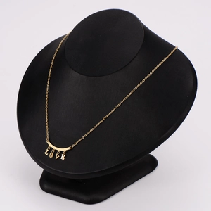 18K gold plated necklace with hanging LOVE letter pendants on a black velvet mannequin