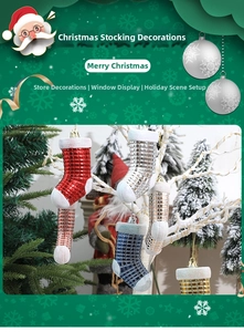 Close-up of glittery checkered Christmas stocking ornaments hanging on festive branches