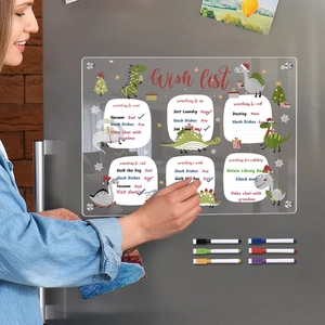 Close-up of dinosaur acrylic wish list calendar board on fridge with 6 markers