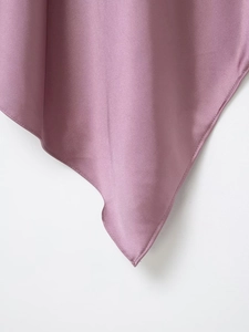 Close-up of premium purple satin fabric showing smooth texture and elegant drape