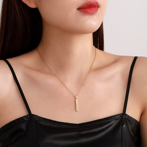 18K gold plated necklace featuring a geometric bar pendant with paved white zircons