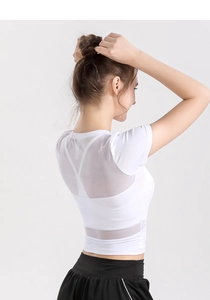 Close-up of white yoga top featuring breathable mesh back panel and slim fit design