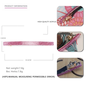 Detail view of 10.6cm long pink glitter acrylic hair clip with metal spring fastener