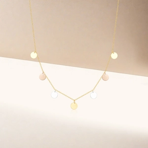 Detail shot of tricolor geometric round tassel disks on a delicate s925 silver chain