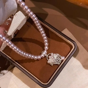 French style pearl necklace with silver flower basket pendant in a jewelry box