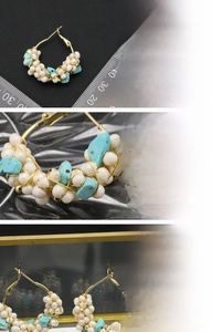 Detail of handmade earrings with natural pearls, turquoise beads and 18K gold plating