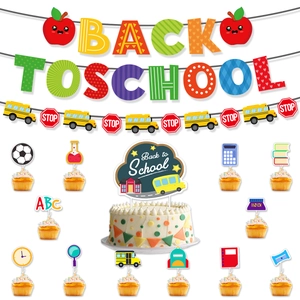 Detail view of Back to School party set with banners, cake toppers, and apple motifs