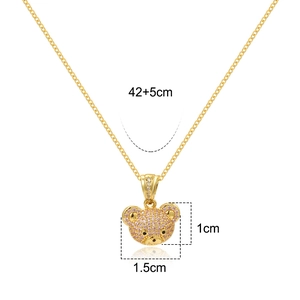 Detail of bear pendant with pink and white cubic zirconia on gold chain, 1.5cm width