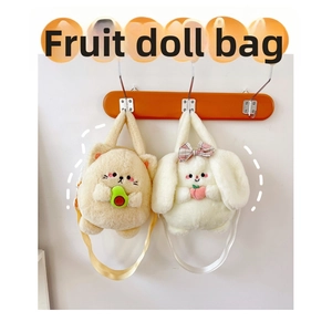 Detail view of plush avocado cat and peach bunny crossbody bags with fluffy texture