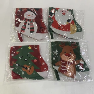 Detail of four festive Christmas stockings with snowman and Santa designs in packaging