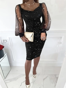 Detail view of elegant black sequin evening dress with sheer mesh puff sleeves