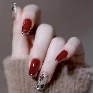Red and silver leopard print press-on nails with glitter finish in long square shape