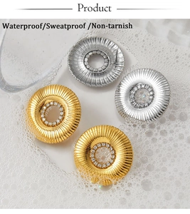 Macro shot of waterproof stainless steel sunflower earrings with sparkling zircon