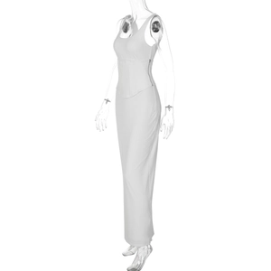 Detail view of the sleek side zipper closure and slim fit waist on white maxi dress