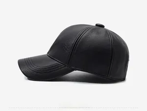 Side view of black textured leather baseball cap with detailed stitching and crown button