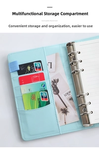 Close-up of light blue PU leather binder with card slots and 6-hole metal ring mechanism
