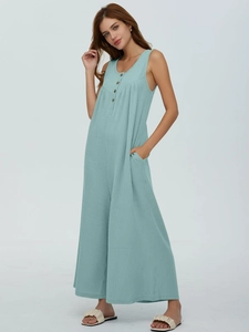 Detail view of mint blue ribbed knit sleeveless jumpsuit with wood-style buttons and pockets
