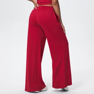 Rear view of red wide-leg leisure trousers showing high-waisted elastic fit and drape