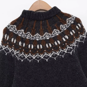 Vintage Fair Isle knit sweater in dark grey with geometric jacquard pattern on hangers
