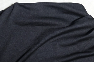 Close-up of high-quality black woven fabric texture with detailed fiber patterns