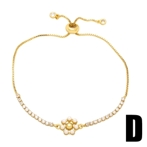 Adjustable gold flower bracelet featuring white pearls and shimmering zircon accents