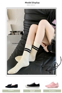 Classic cream ribbed crew socks with double black stripes styled with diverse shoes