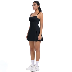 Detail view of the black athletic mini dress featuring thin straps and side slit detail