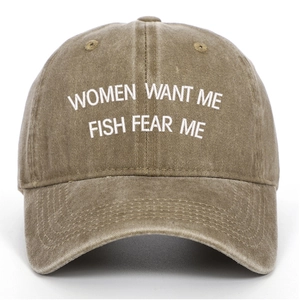 Close-up view of vintage washed baseball cap featuring white embroidered slogan on crown