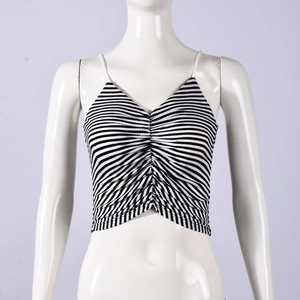 Detail shot of the black and white striped knit texture and ruched chest of the camisole