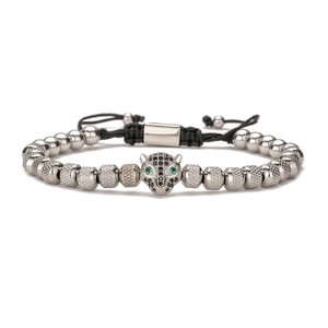 Silver leopard head beaded bracelet with emerald green eyes and adjustable black cord