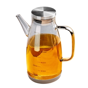 Clear glass oil dispenser with 1000ml scale markings and stainless steel lid on white background