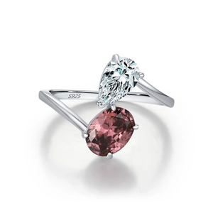 S925 sterling silver dual stone ring with teardrop and oval cut gems on white background