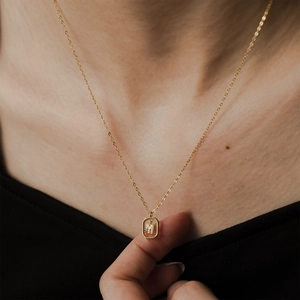 Gold S925 sterling silver necklace featuring a square pendant with letter M and crystals
