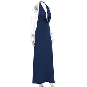 Detail of navy blue halter dress showing deep V-neck and draped textured fabric