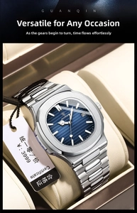 Close-up of a men's steel watch with a blue textured dial in a leather display case