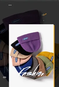 Detail showing various colors of ribbed knit beanies with ORDERLINESS logo patch
