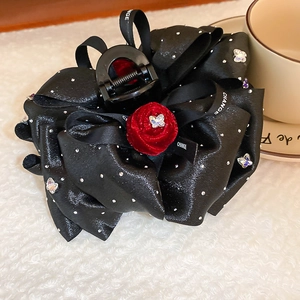 Elegant black fabric bow hair claw with red rose and rhinestone accents for women
