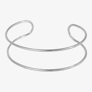 Macro view of double-layered stainless steel open cuff bracelet with polished silver finish