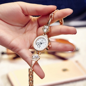 Elegant rose gold women's quartz watch with double heart dial and floral metal chain