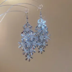Elegant snowflake drop earrings with sparkling crystals and silver tassel ear hooks