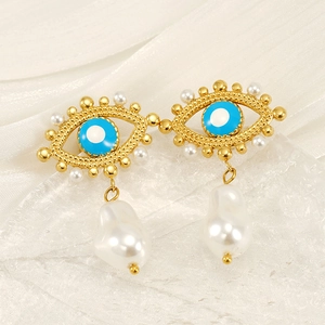 Elegant gold Evil Eye earrings featuring blue enamel and large baroque pearl drops
