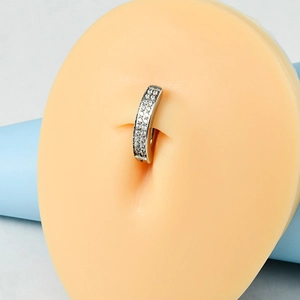 Detail of silver belly ring with double row clear zircons shown on silicone model