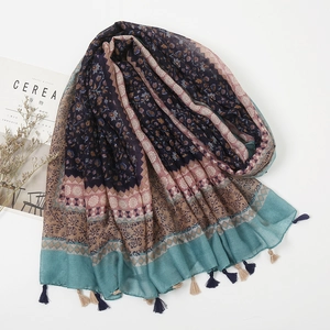 Bohemian floral patchwork linen scarf with tassels displayed on a minimalist background