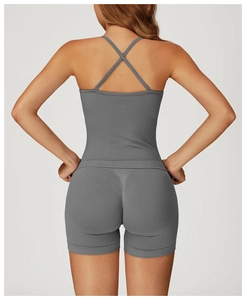 Detail of cross-strap back design on gray seamless yoga top with ribbed texture fabric